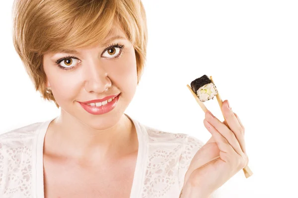 Mujer con sushi sobre un fondo blanco. estudio —  Fotos de Stock