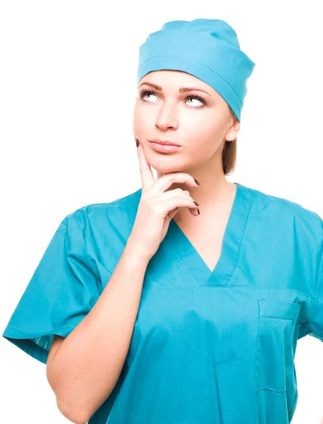Enfermera atractiva mira hacia arriba — Foto de Stock