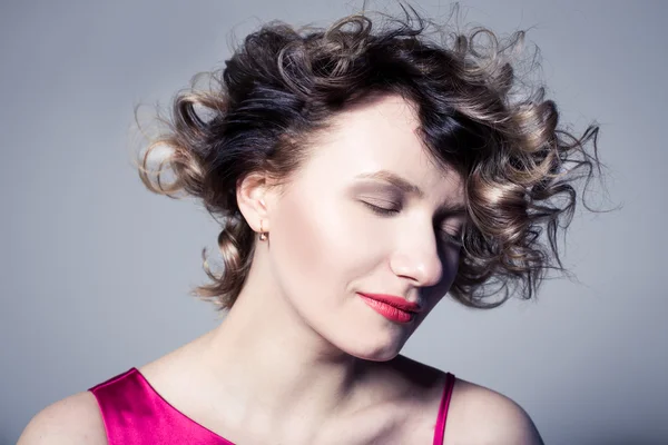 Sensitive curly blonde in studio — Stock Photo, Image