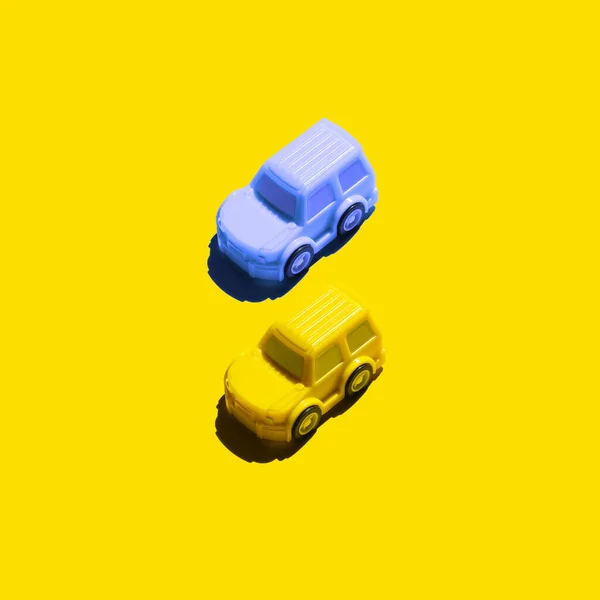 two cars on a yellow background. Concept about Ukraine