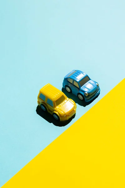 two cars on a yellow background. Concept about Ukraines car