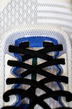 Black lacing on a white shoe