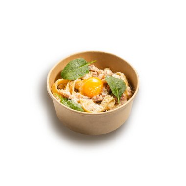 Classic Carbonara pasta, spaghetti with pancetta, bacon, egg, parmesan cheese and green basil