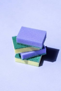 pyramid of different washcloths on a purple background