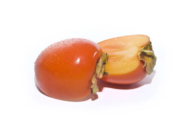 Persimmon est coupé en deux morceaux isolés — Photo