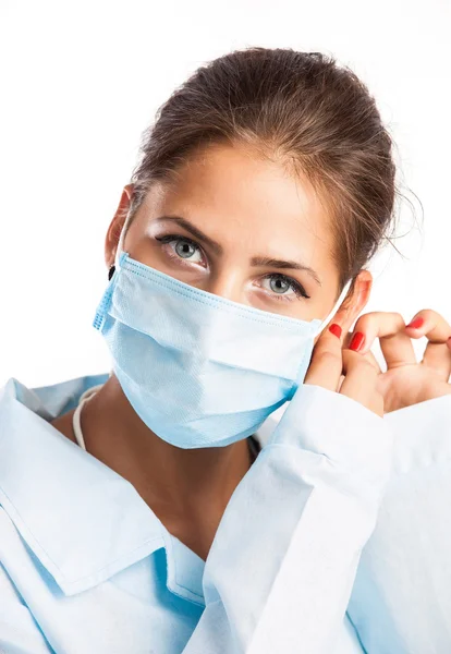 Closeup portrait of a young doctor wearing a mask — Stock Photo, Image