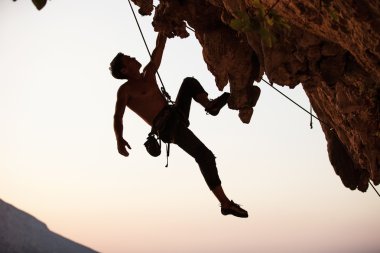 Silhouette of a rock climber