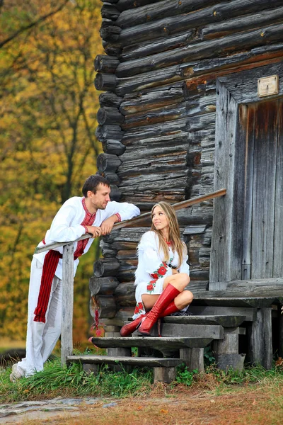 Young couple in Ukrainian style clothes flirting — Stock Photo, Image