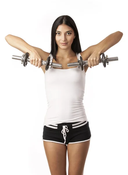 Carino fitness ragazza che lavora con manubri su sfondo bianco — Foto Stock