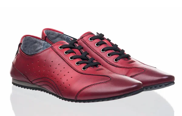 Ett par röda kvinnlig idrott skor — Stockfoto