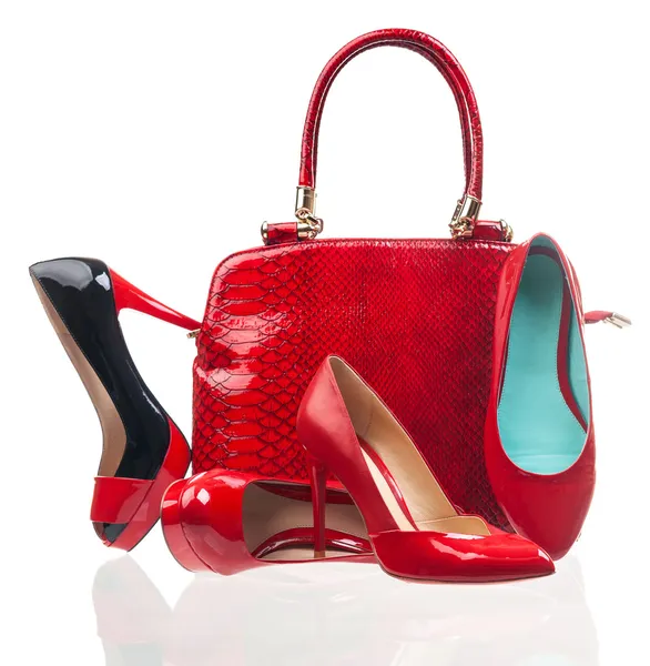 Red fashion women shoes and handbag over white Stock Photo