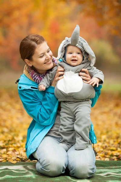 Young woman and her baby boy dressed in costume — Stock Photo, Image