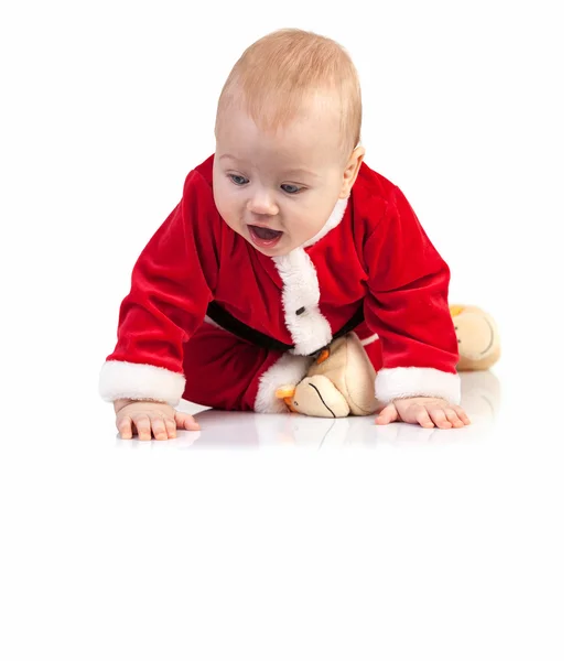 Küçük çocuk Noel Baba kostümlü aşağı bakıyor — Stok fotoğraf
