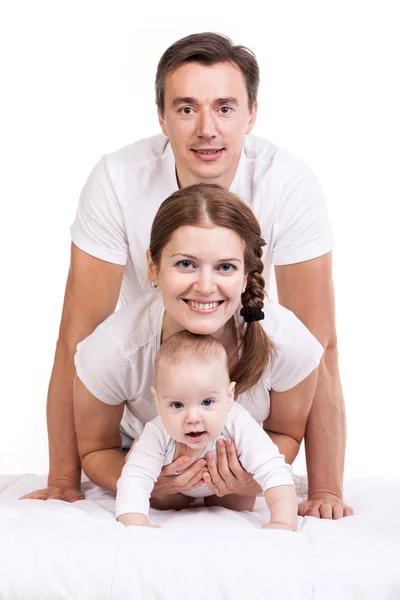 Família jovem com bebê menino sobre branco — Fotografia de Stock