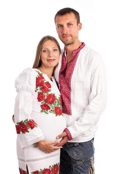 Young couple in Ukrainian style clothing on white — Stock Photo, Image