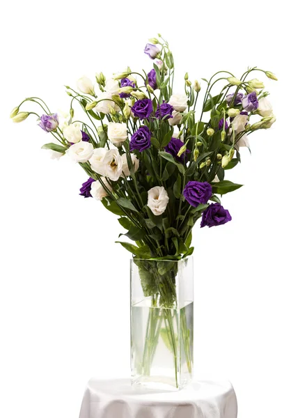 Bouquet of eustoma flowers in vases over white — Stock Photo, Image