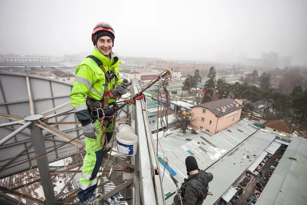 Industrial climber on a metal construction — Stock Photo, Image