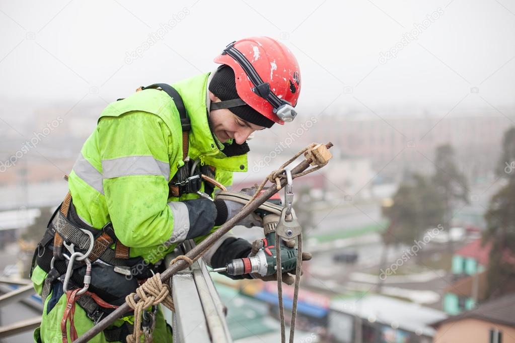 Industrial climber on a metal construction