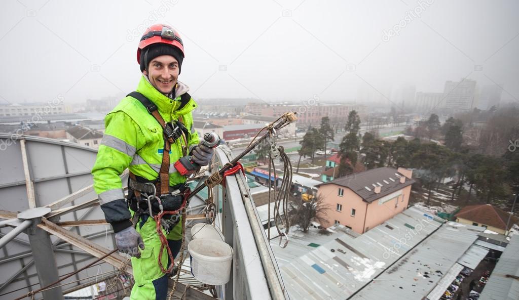 Industrial climber on a metal construction