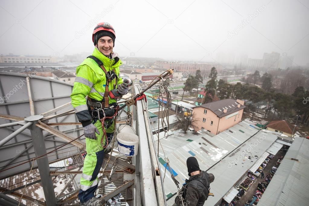 Industrial climber on a metal construction