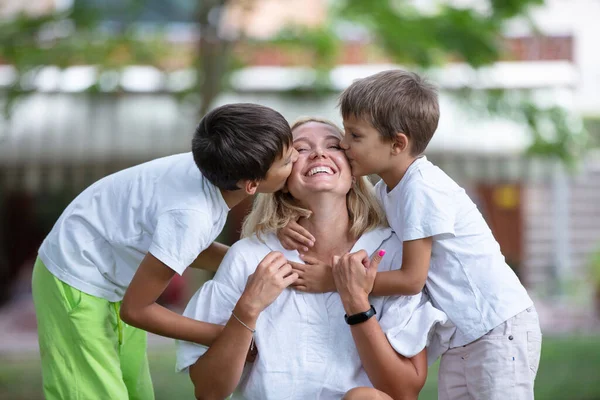 Two Young Boys Kissing Mother Summer Park — Stock Photo, Image