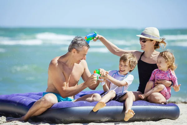 Happy Family Four Having Fun Large Air Mattress Beach — Stock Photo, Image