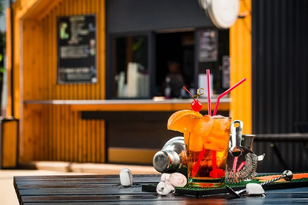 Orange cocktail decorated with slice of orange and cherry, Cocktail tequila sunrise or Whiskey sour cocktail