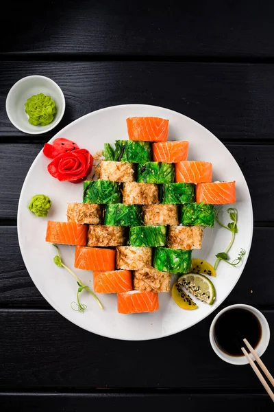 Sushi roll set in restaurant served in white plate Japan cuisine