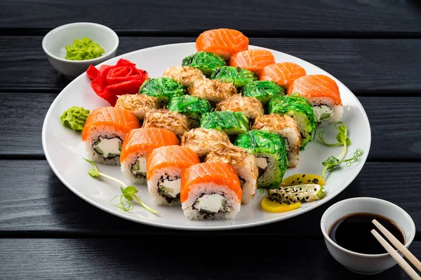 Sushi roll set in restaurant served in white plate Japan cuisine