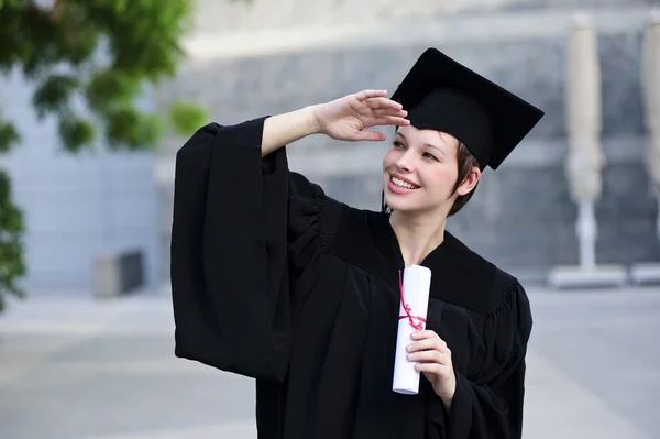 Just graduated female student think about future and enjoy freedom. — Stock Photo, Image