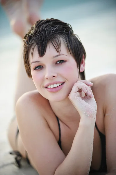 Portrait of young woman enjoying outdoors at the beach — Stock Photo, Image