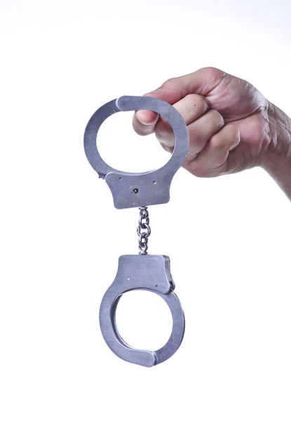 Picture of handcuffs,hanging on finger — Stock Photo, Image