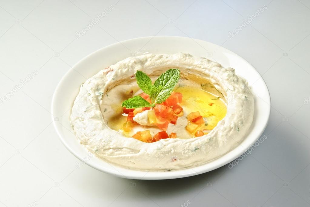 The traditional Middle Eastern , hummus with mint leaf
