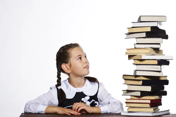 Portrait of cute school girl on white background with books — Stock Photo, Image