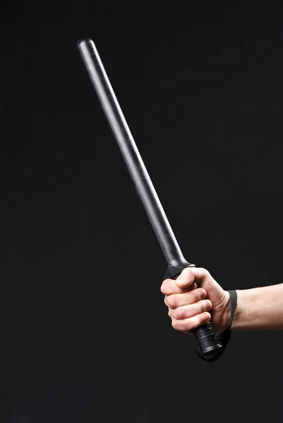 Close up of hand with truncheon — Stock Photo, Image