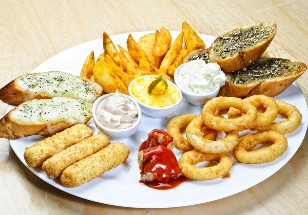 Plate with different kinds of appetizers — Stock Photo, Image