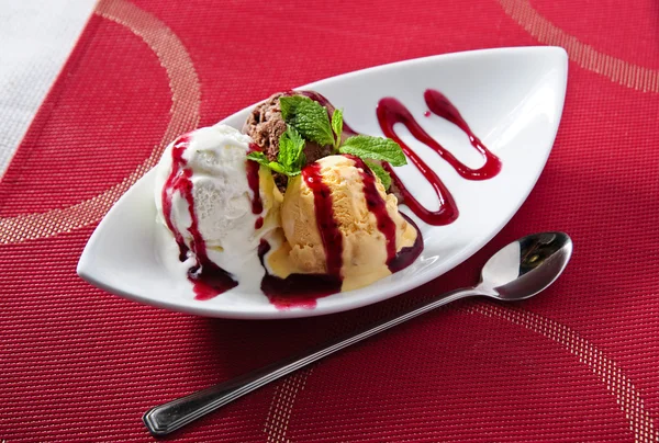 Many-colored scoops of exclusive ice cream on narrow plate — Stock Photo, Image