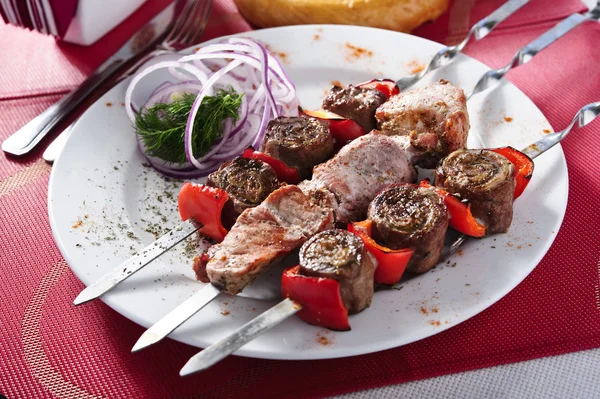 Plate of shish kebab arranged on table — Stock Photo, Image