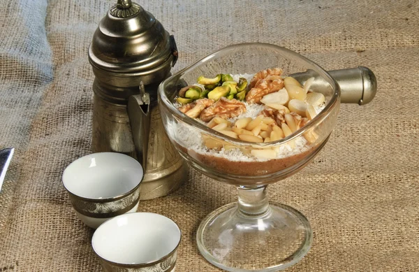 Oriental Arabic coffee dessert topped with nuts — Stock Photo, Image