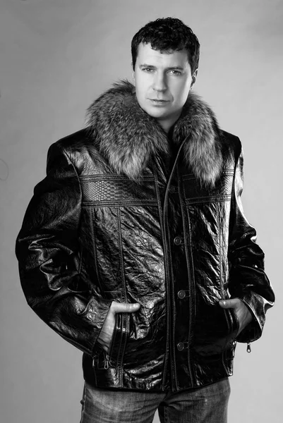 Studio portrait of male model in leather jacket — Stock Photo, Image