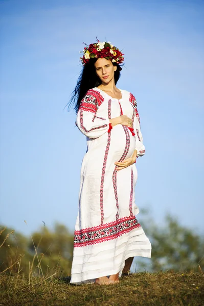 Outdoor portrait of beautiful pregnant Slav woman Stock Photo