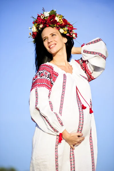 Outdoor portrait of beautiful pregnant Slav woman Stock Picture