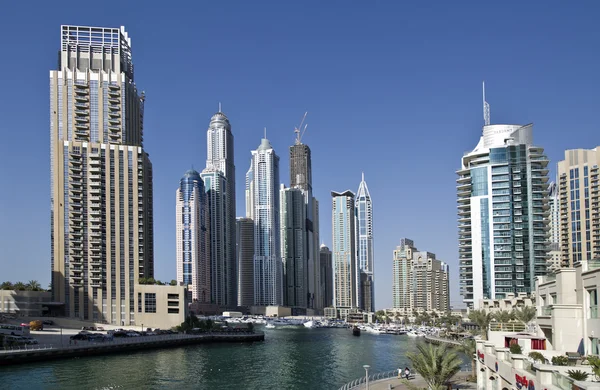 DUBAI, UAE - FEBRUARY 22: View of modern skyscrapers in Dubai Marina on February 22, 2013 in Dubai, UAE. Dubai Marina - artificial canal city, carved along a 3 km stretch of Persian Gulf shoreline. — Stock Photo, Image