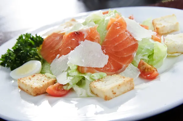 Italian vegetable salad topped with red salmon — Stock Photo, Image