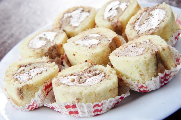 Plate of Italian sweet rolled cakes — Stock Photo, Image