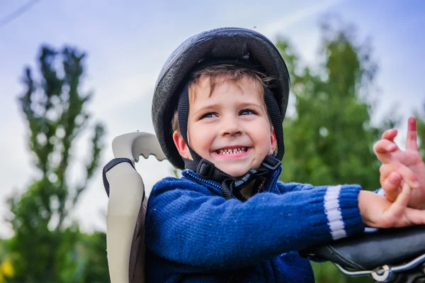 Portrait of cute boy on bike helmet — Stock Photo, Image