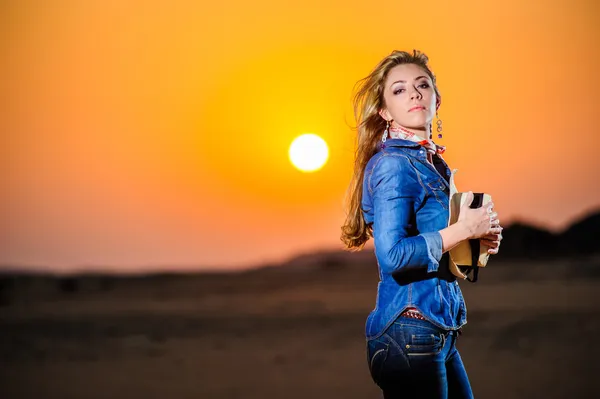 Portrait of beautiful country girl in front of red sunset — Stock Photo, Image