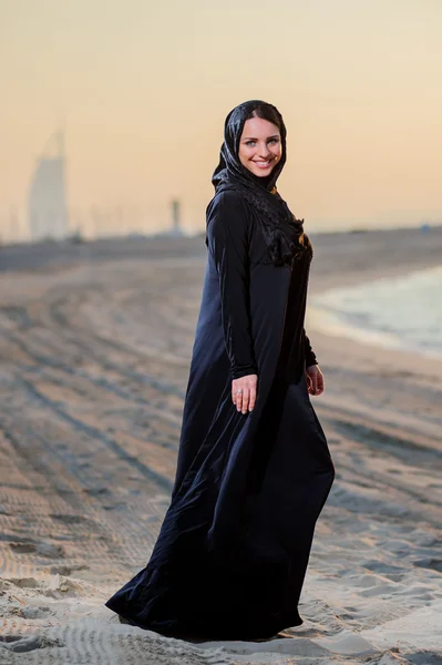 Women dressed middle eastern way poses on sunset background — Stock Photo, Image