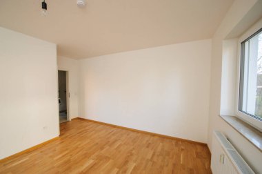 Cozy studio apartment design with bedroom and living space. Hotel room panoramic window, double bed, sofa and coffee table. Urban apartment concept