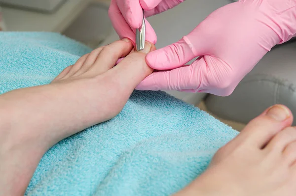 Foot massage in the spa salon.Woman in a beauty salon for pedicure and foot massage.